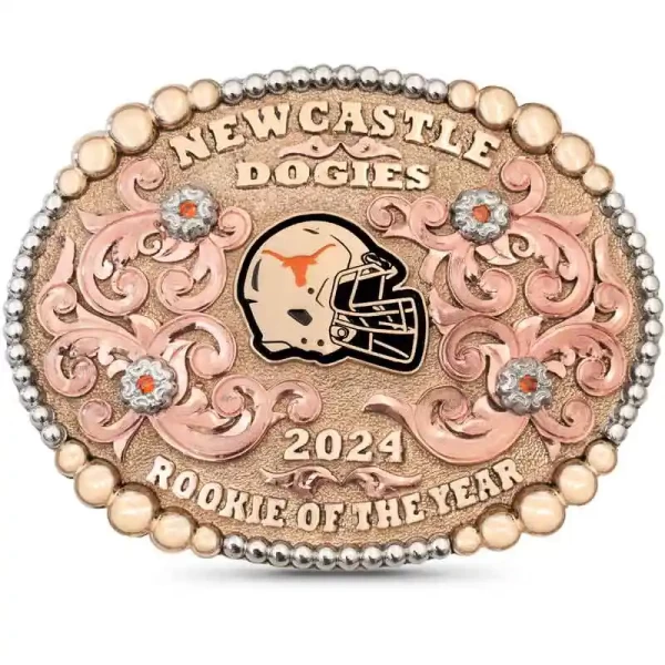 A custom rodeo belt buckle for Corpus Christi High School with personalized name featuring a golden bronze cowboy figure 